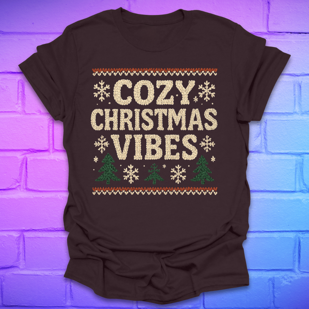 Brown t-shirt with 'Cozy Christmas Vibes' text on a brick wall background