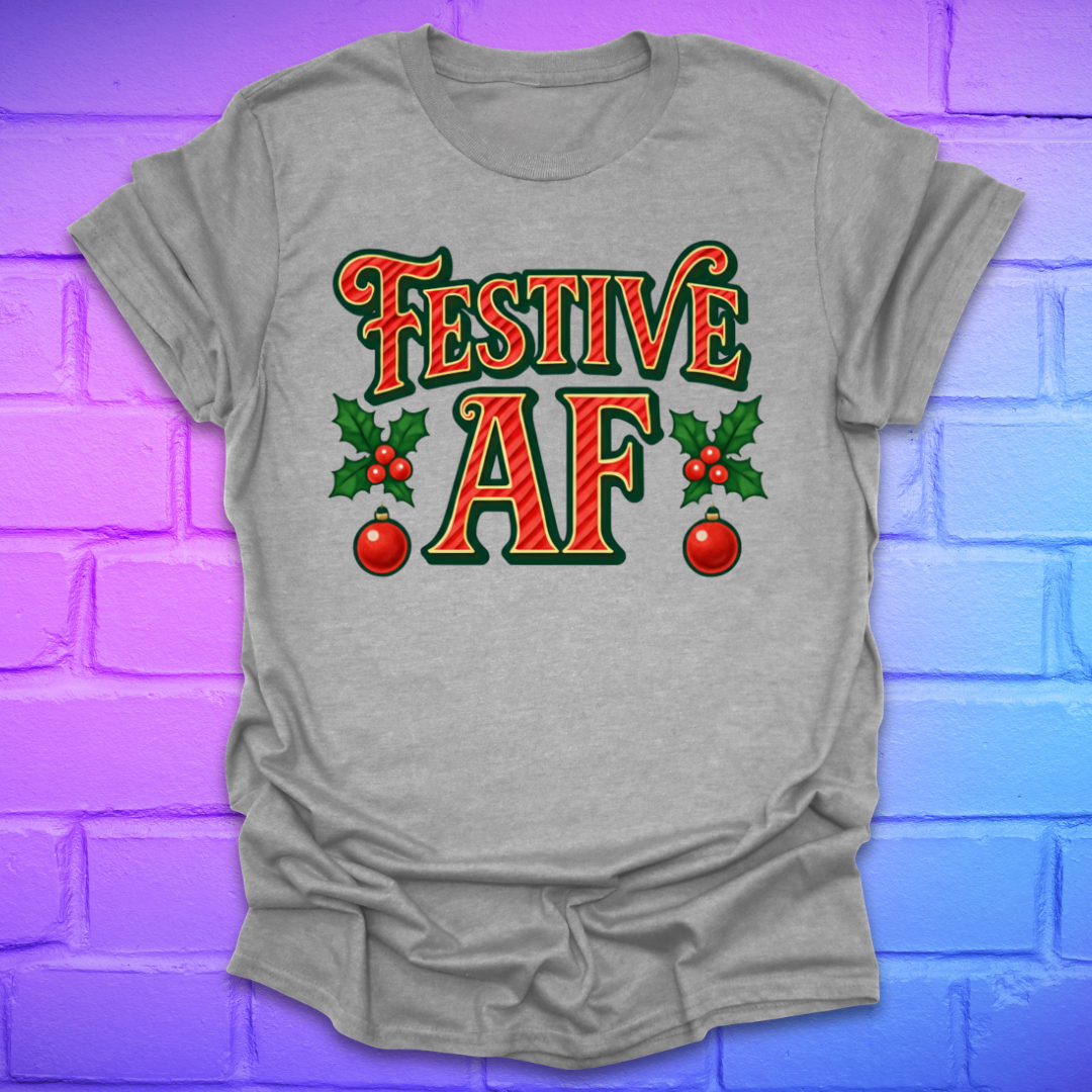 Gray t-shirt with 'Festive AF' text and holly design on a colorful brick wall background