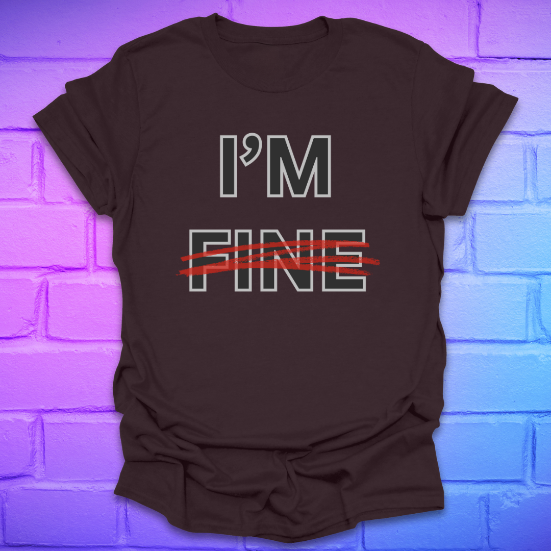 Brown t-shirt with 'I'm Fine' text with fine crossed out in red, on a brick wall background