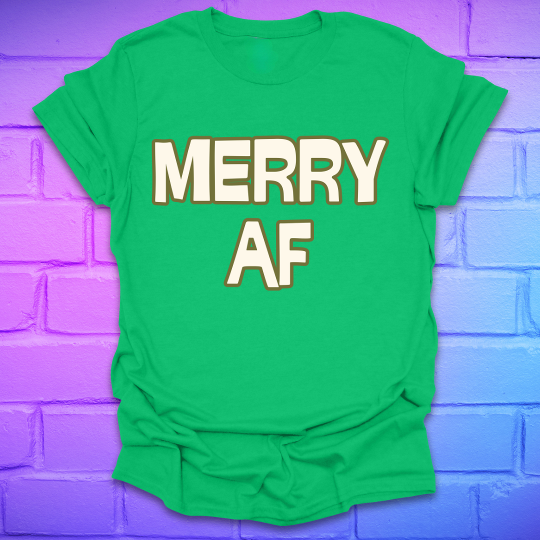 Green t-shirt with 'MERRY AF' text on a purple brick wall background