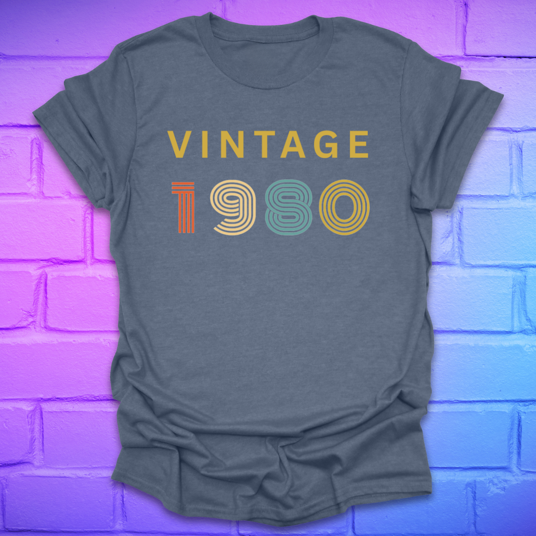 Heather indigo t-shirt with 'Vintage 1980' text on a brick wall background