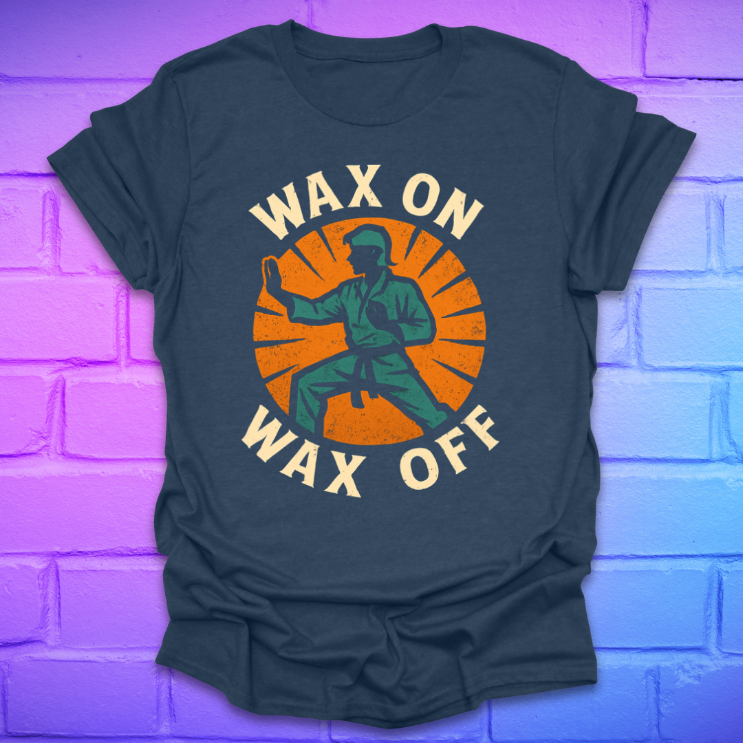 light navy T-shirt with 'Wax On Wax Off' graphic design on a brick wall background