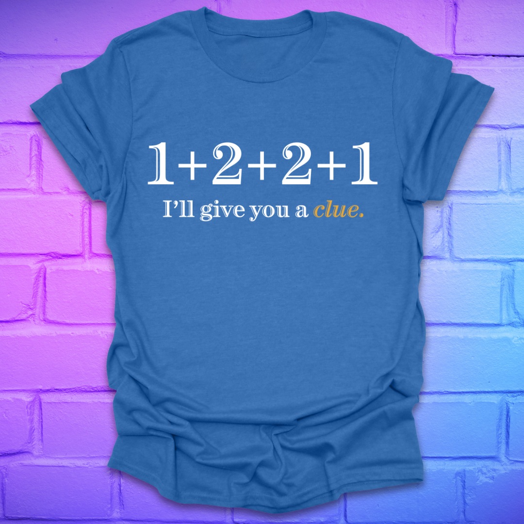 Royal t-shirt with 1+2+2+1 and text, 'I'll give you a clue' on a brick background.