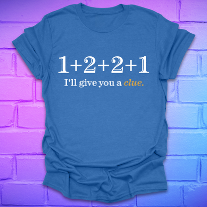 Royal t-shirt with 1+2+2+1 and text, 'I'll give you a clue' on a brick background.