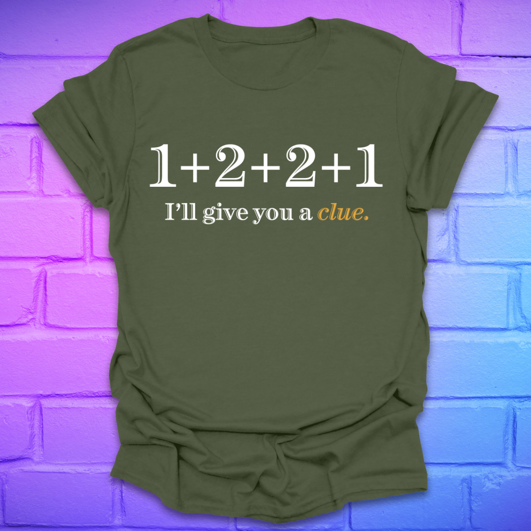 Green t-shirt with 1+2+2+1 and text, 'I'll give you a clue' on a brick background.
