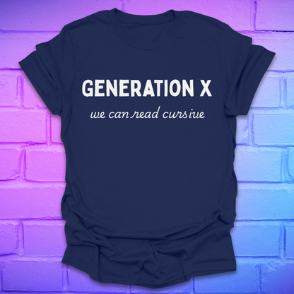 Navy blue t-shirt with 'Generation X, we can read cursive' text on a brick wall background