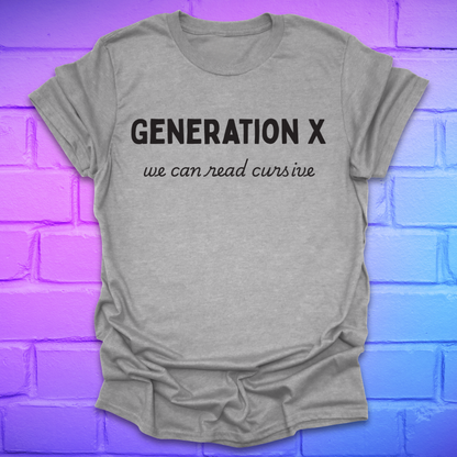 Gray t-shirt with 'Generation X, we can read cursive' text on a brick wall background