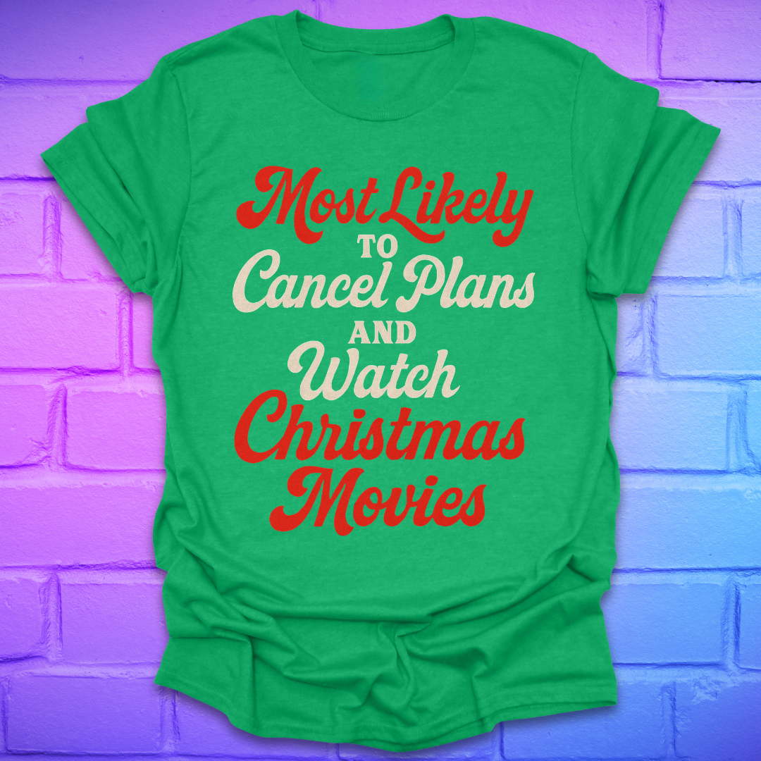 Green t-shirt with Christmas-themed text on a purple brick wall background