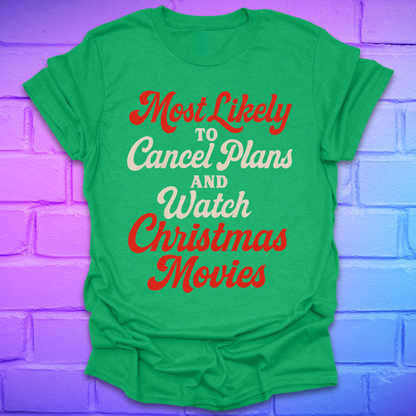 Green t-shirt with Christmas-themed text on a purple brick wall background