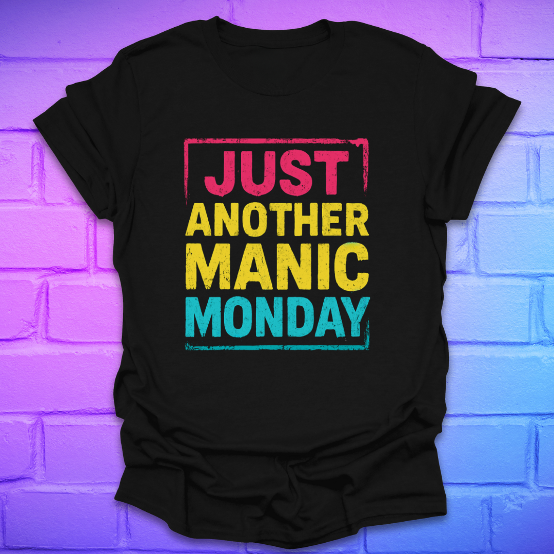 Black t-shirt with bright bold text, 'Just another manic monday' on a brick background.