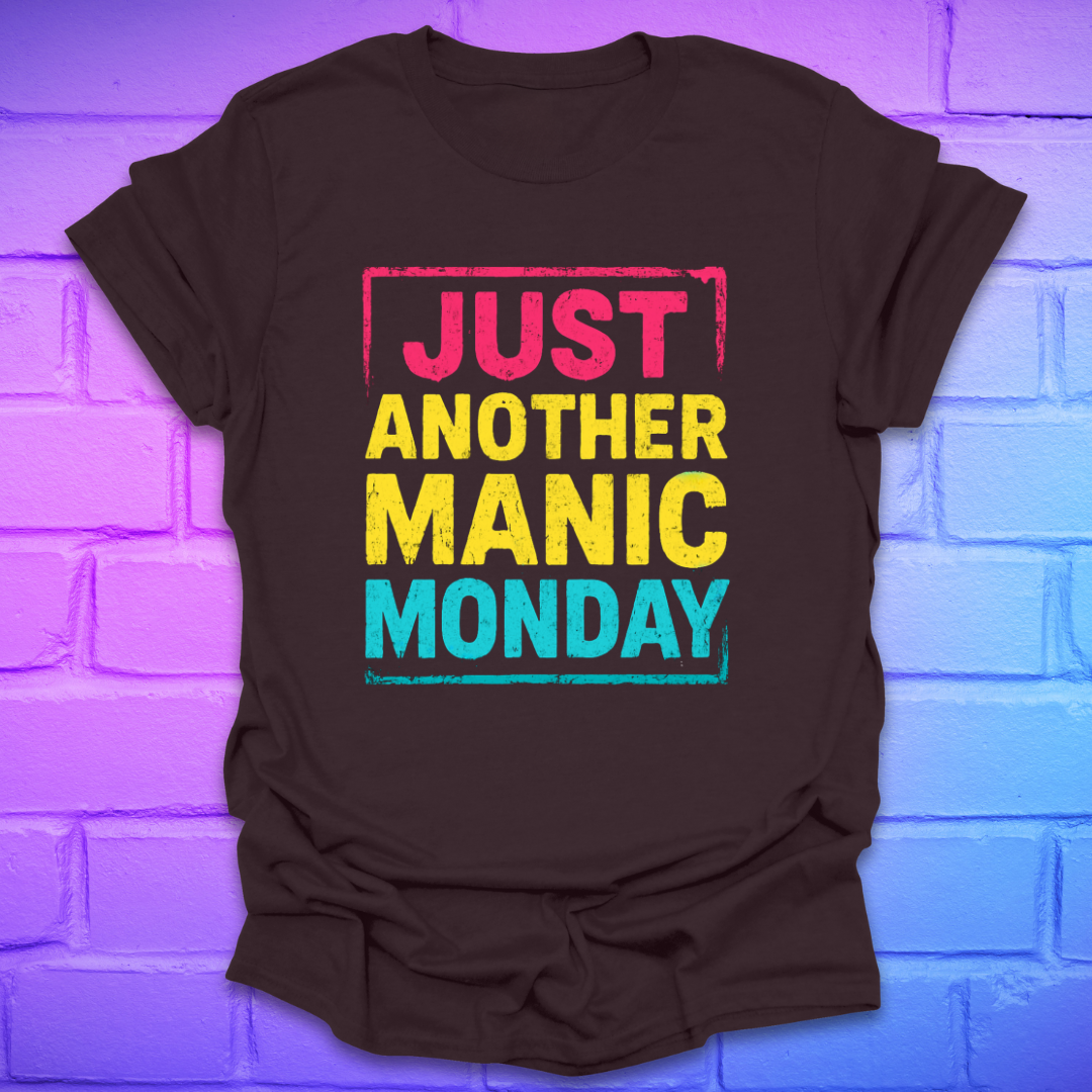 Brown t-shirt with bright bold text, 'Just another manic monday' on a brick background.