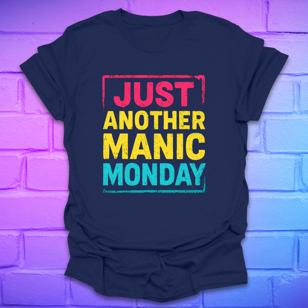 Navy blue t-shirt with bright bold text, 'Just another manic monday' on a brick background.