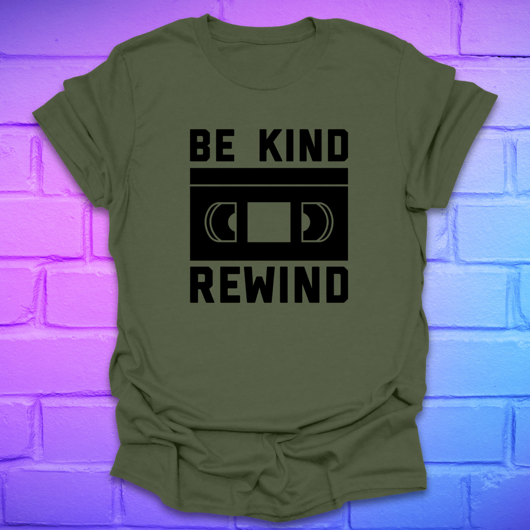 Green t-shirt with 'Be Kind Rewind' text on a brick wall background