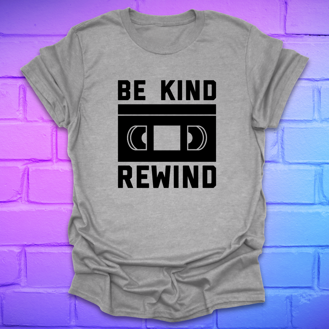 Gray t-shirt with 'Be Kind Rewind' text design on a brick wall background