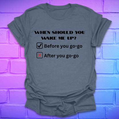 Gray t-shirt with humorous text design on a brick wall background