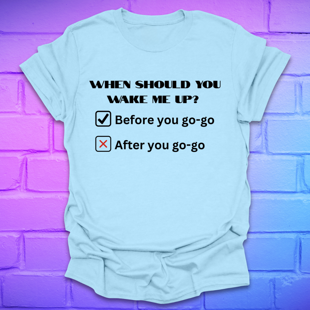 Light blue t-shirt with humorous text design on a purple brick wall background