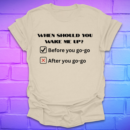 Beige t-shirt with humorous text design on a brick wall background