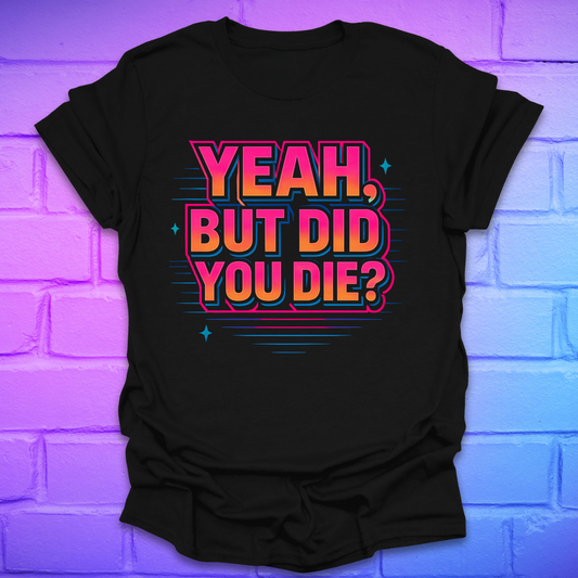 Black t-shirt with colorful text 'Yeah, but did you die?' on a brick wall background