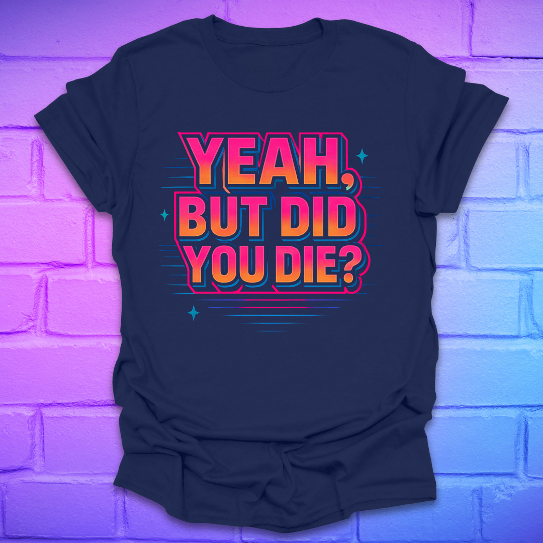 Navy blue t-shirt with colorful text 'Yeah, but did you die?' on a brick wall background