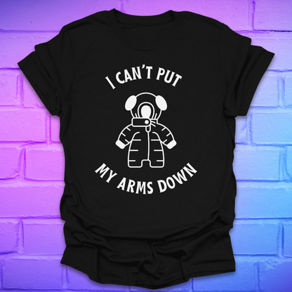 Black t-shirt with white graphic and text, 'i can't put my arms down' on a brick wall background