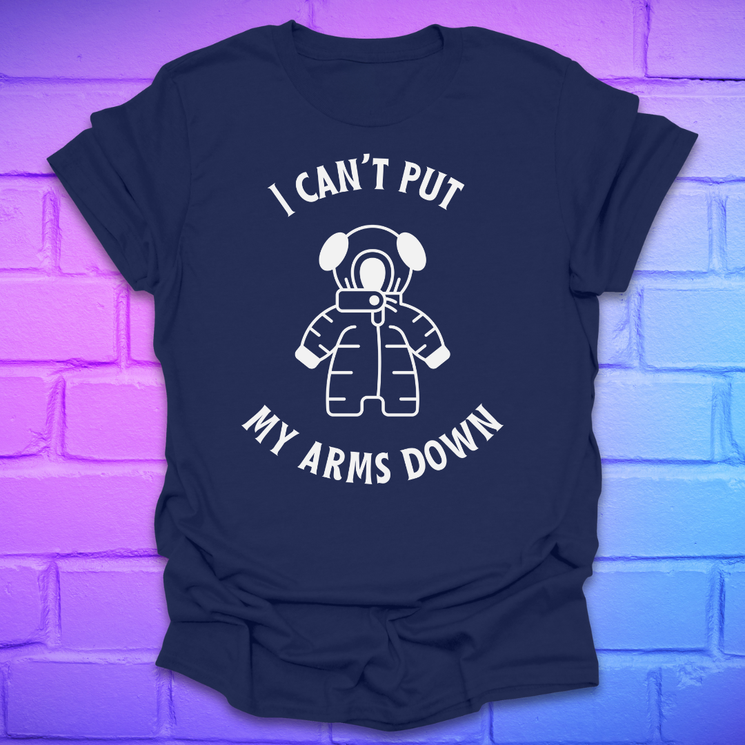 Navy t-shirt with white graphic and text, 'i can't put my arms down' on a brick wall background