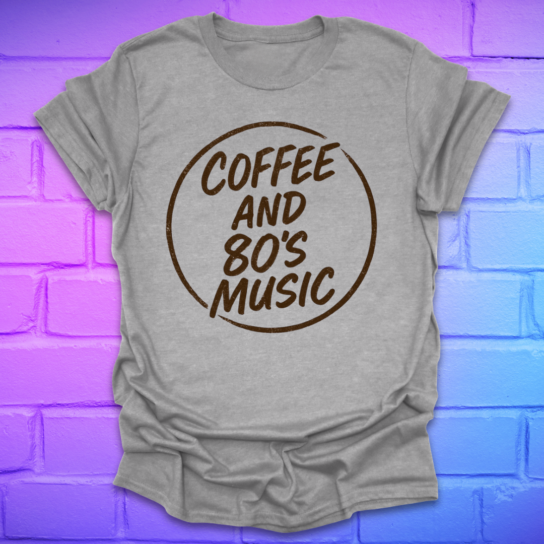 Gray t-shirt with 'Coffee and 80's Music' text on a brick wall background