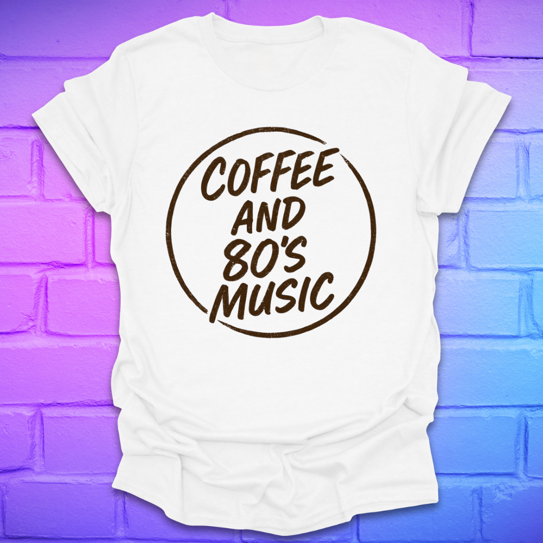 White t-shirt with 'Coffee and 80's Music' text on a purple brick wall background