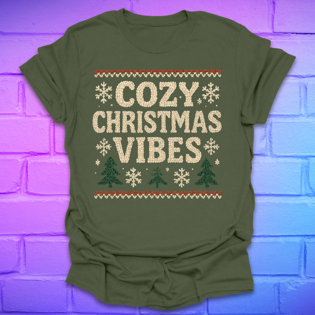 Green t-shirt with 'Cozy Christmas Vibes' text on a brick wall background