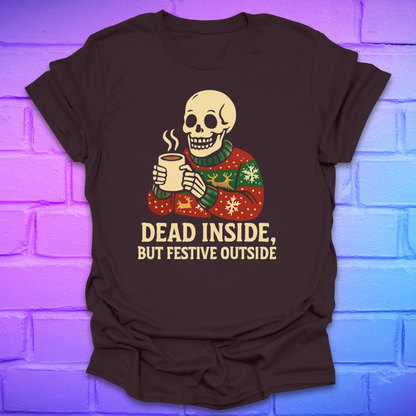 Brown t-shirt with a skeleton holding a mug and text 'Dead Inside, But Festive Outside' on a brick wall background.