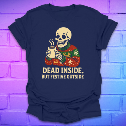 Navy blue t-shirt with a skeleton wearing a sweater and holding a mug, text 'Dead Inside, But Festive Outside' on a brick wall background.