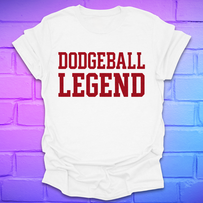 White t-shirt with 'Dodgeball Legend' text on a purple brick wall background