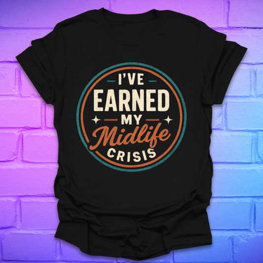 Black t-shirt with 'I've Earned My Midlife Crisis' text on a brick wall background
