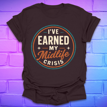 Brown t-shirt with 'I've Earned My Midlife Crisis' text on a brick wall background