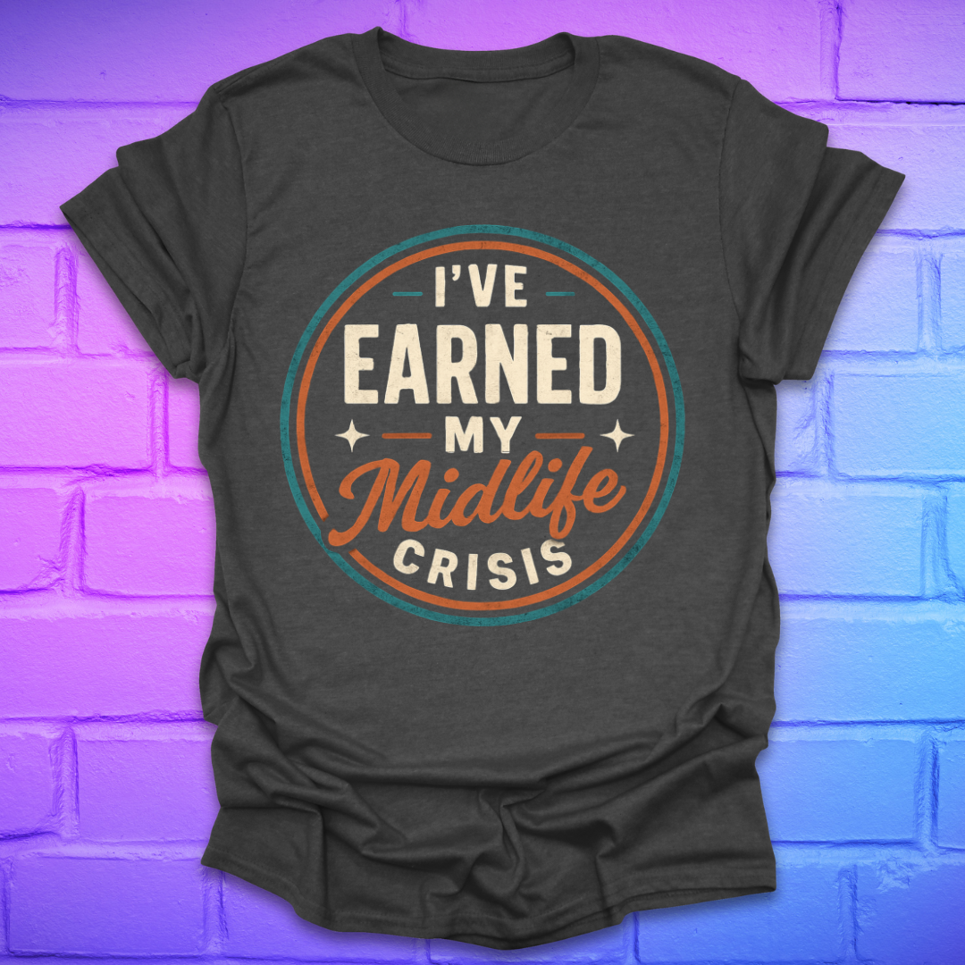 Dark gray t-shirt with 'I've Earned My Midlife Crisis' text on a brick wall background