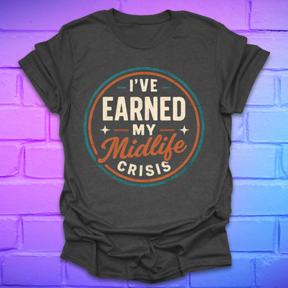 Dark gray t-shirt with 'I've Earned My Midlife Crisis' text on a brick wall background