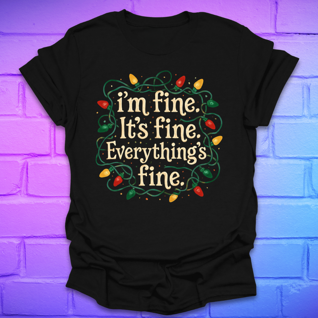 Black t-shirt with tangled christmas lights and text 'I'm fine. it's fine. everything's fine.' on a brick background.
