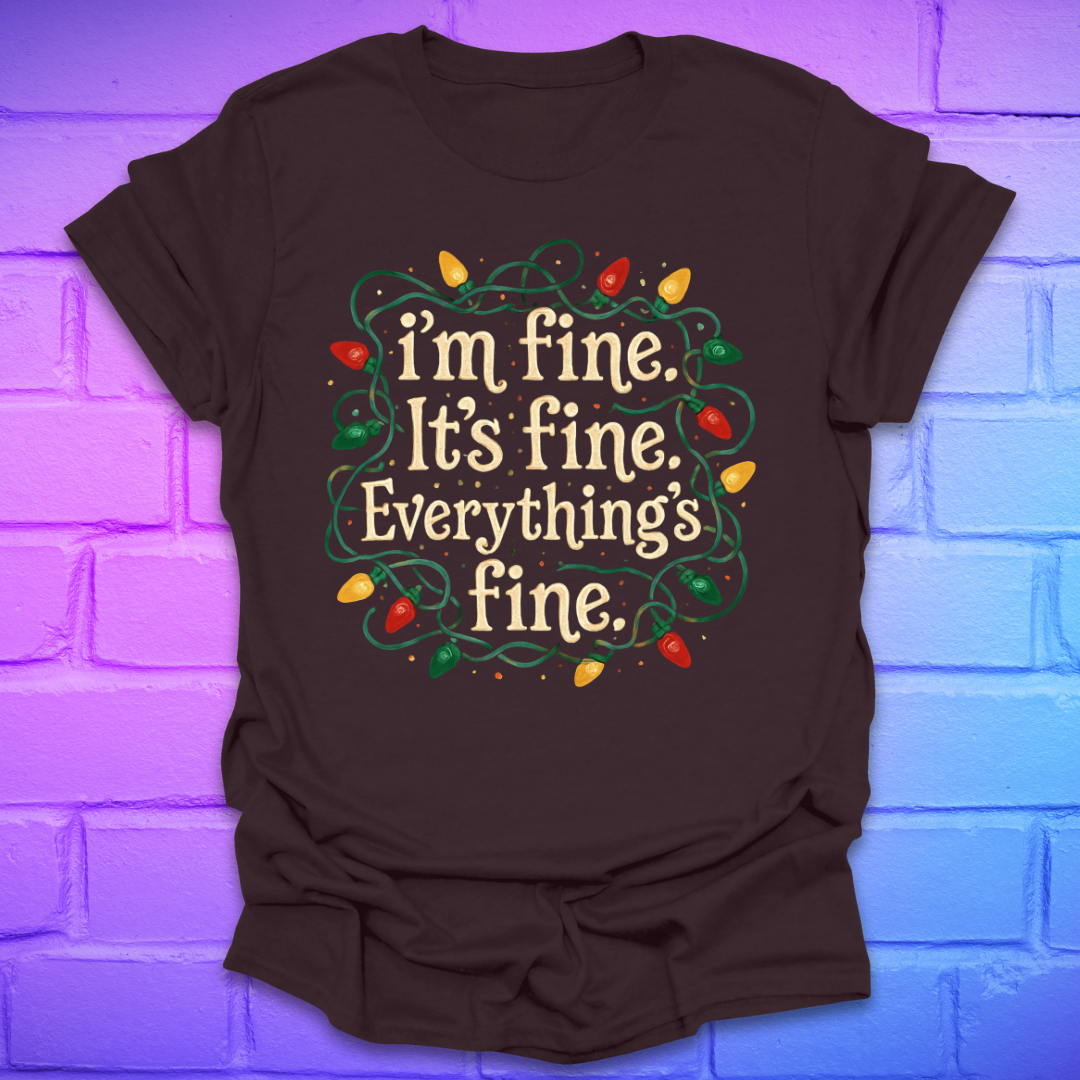 Brown t-shirt with tangled christmas lights and text 'I'm fine. it's fine. everything's fine.' on a brick background.