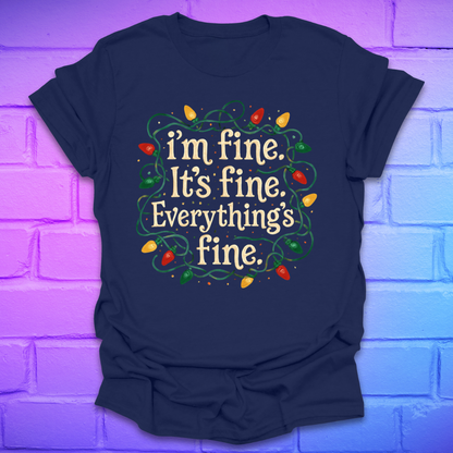 Navy blue t-shirt with tangled christmas lights and text 'I'm fine. it's fine. everything's fine.' on a brick background.