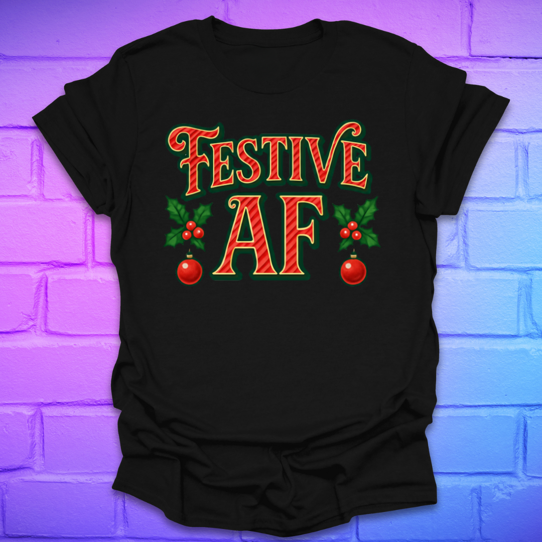 Black t-shirt with 'Festive AF' text and holly design on a brick wall background
