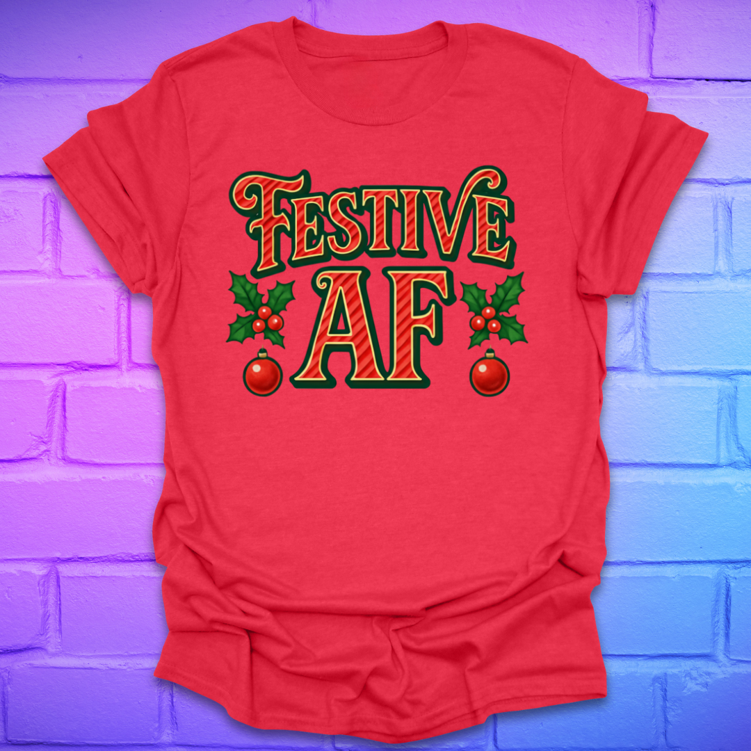 Red t-shirt with 'Festive AF' text and holly design on a brick wall background