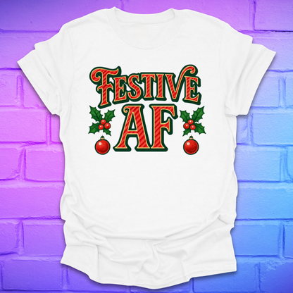 White t-shirt with 'Festive AF' text on a colorful brick wall background