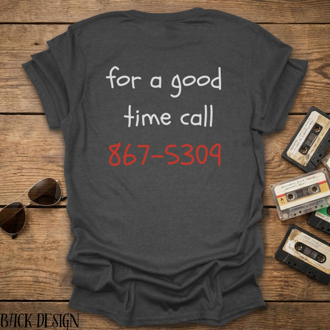 Gray t-shirt with phone number on a wooden surface with sunglasses and cassettes.