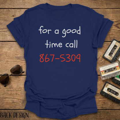 Navy blue t-shirt with phone number text on a wooden surface with vintage cassettes and sunglasses.