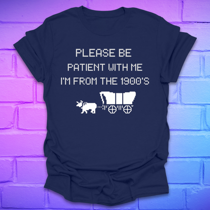 Navy blue t-shirt with white text, 'please be patient with me im from the 1900s' and graphics on a brick wall background