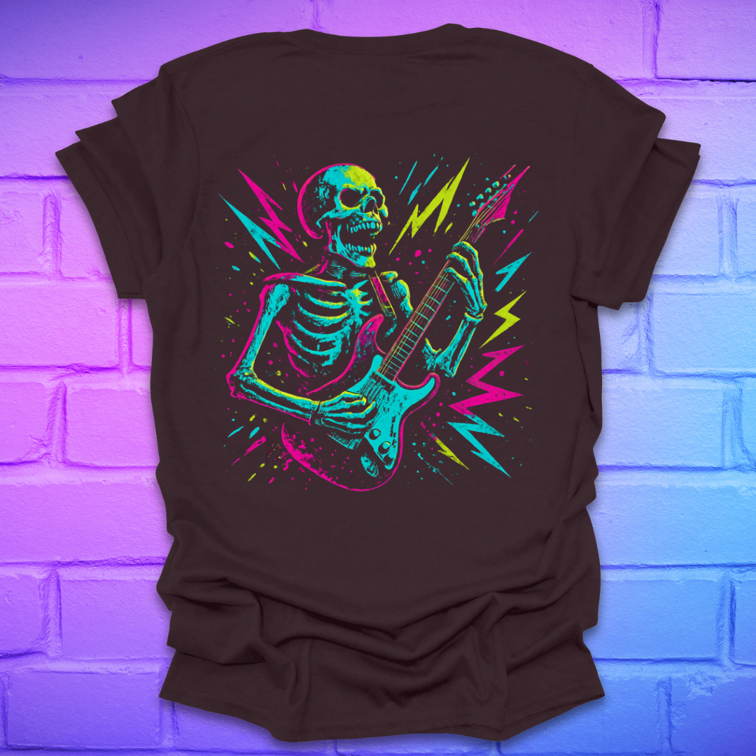 Brown t-shirt with a colorful skeleton playing guitar design on the back of shirt on a brick wall background