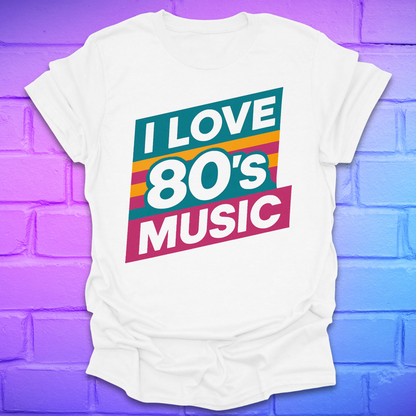 White t-shirt with 'I LOVE 80'S MUSIC' text on a colorful brick background