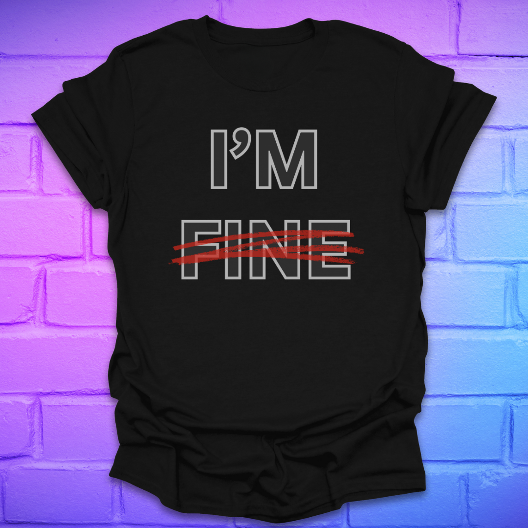 Black t-shirt with 'I'm Fine' text with fine crossed out in red, on a brick wall background