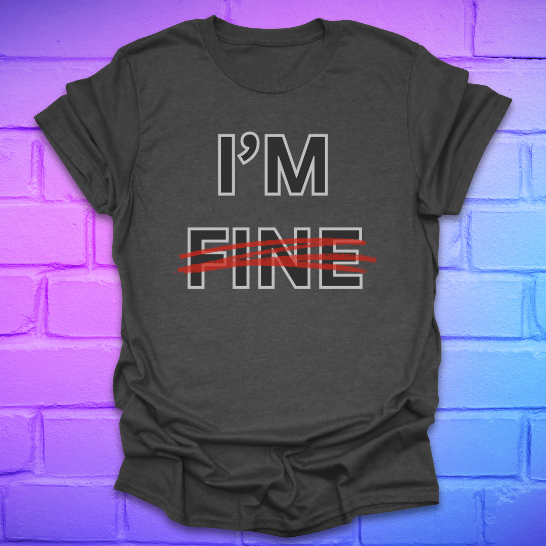 Grey t-shirt with 'I'm Fine' text with fine crossed out in red, on a brick wall background