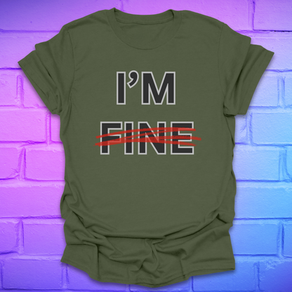 Green t-shirt with 'I'm Fine' text with fine crossed out in red, on a brick wall background