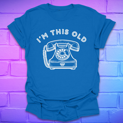 Royal Blue t-shirt with a white phone graphic and text on a purple brick wall background